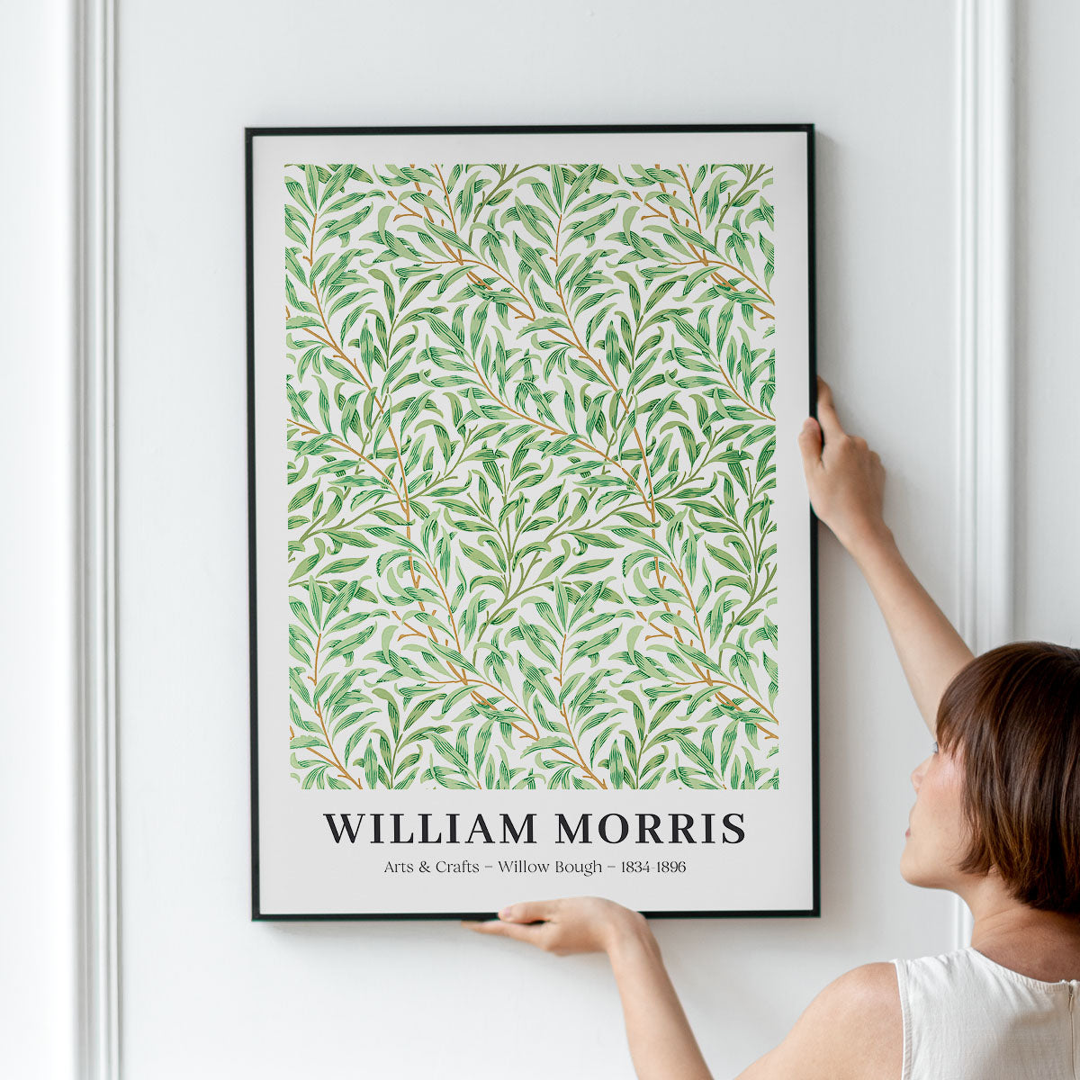 William Morris plakat med titlen "Willow Bough" hængt op på en hvid væg.