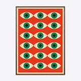 Plakat i egetræsramme med et Bauhaus-inspireret design af gentagne øjenmotiver på en rød baggrund.