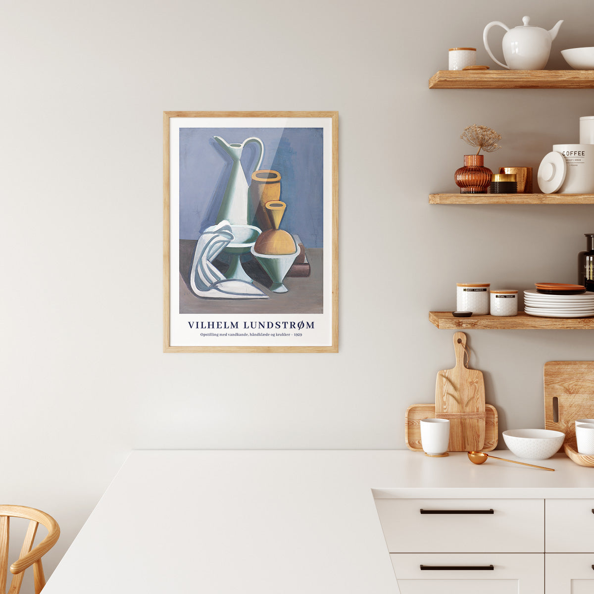 Plakat i træramme i køkken med motiv af Vilhelm Lundstrøm.