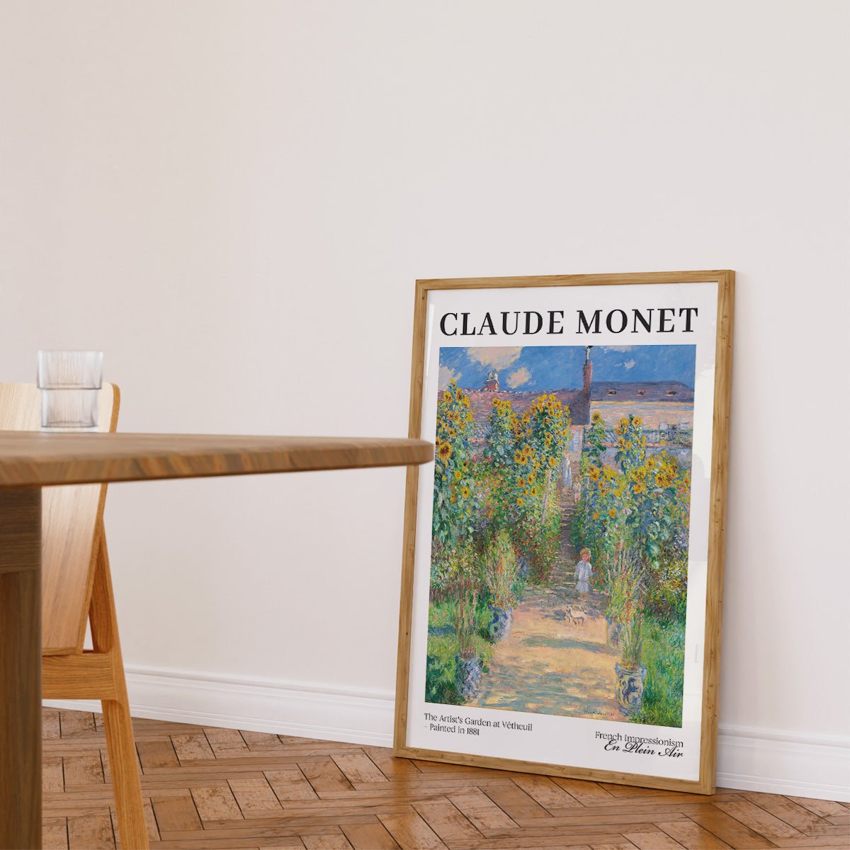 Monet plakat af kunstnerens have i Vétheuil i træramme på gulvet